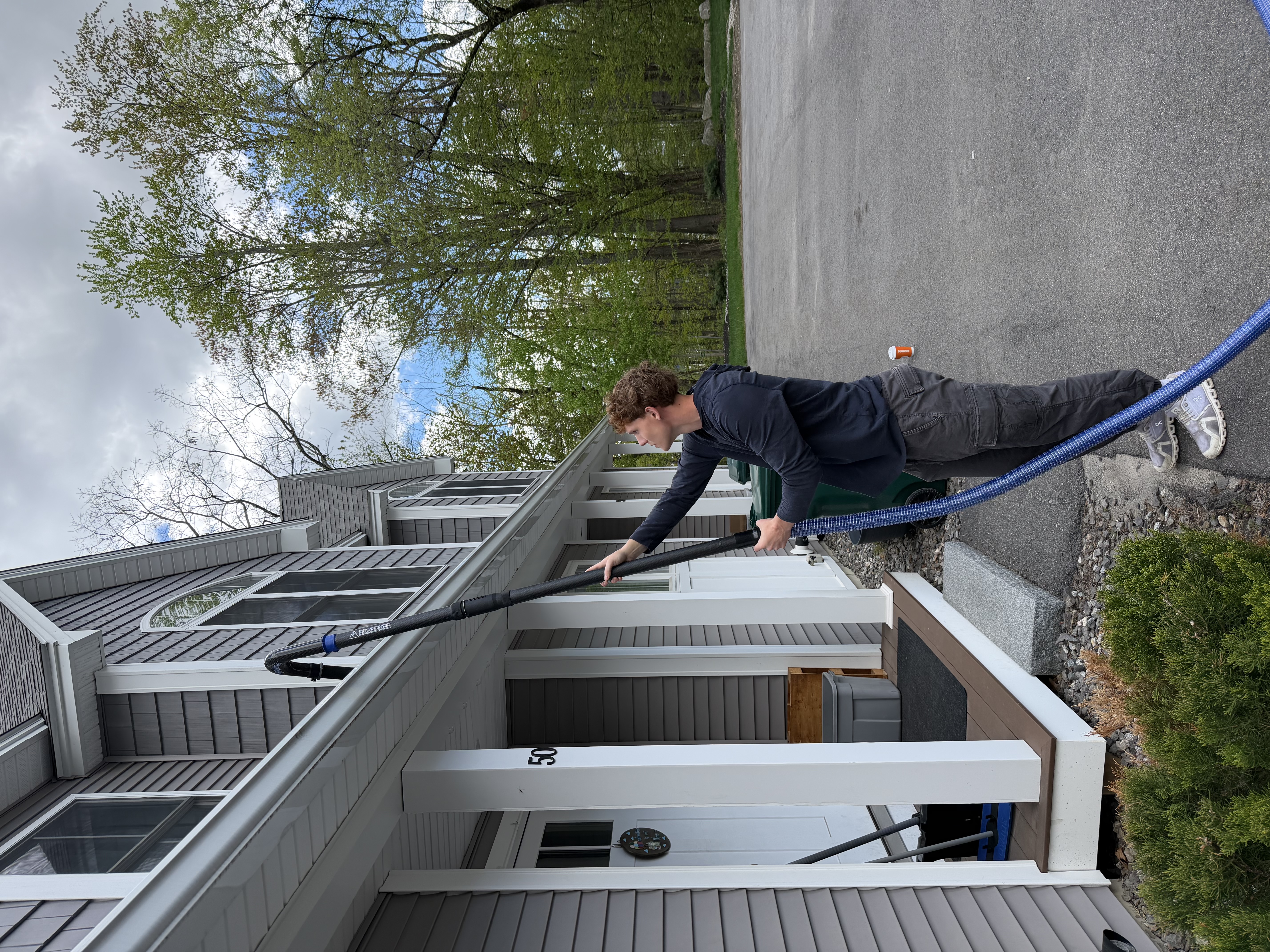 Canaway Gutters crew with vacuum equipment on a residential job